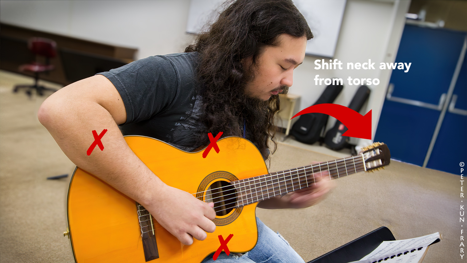 Casual Position | Shifting the guitar's neck away from your torso allows access to the entire fingerboard.