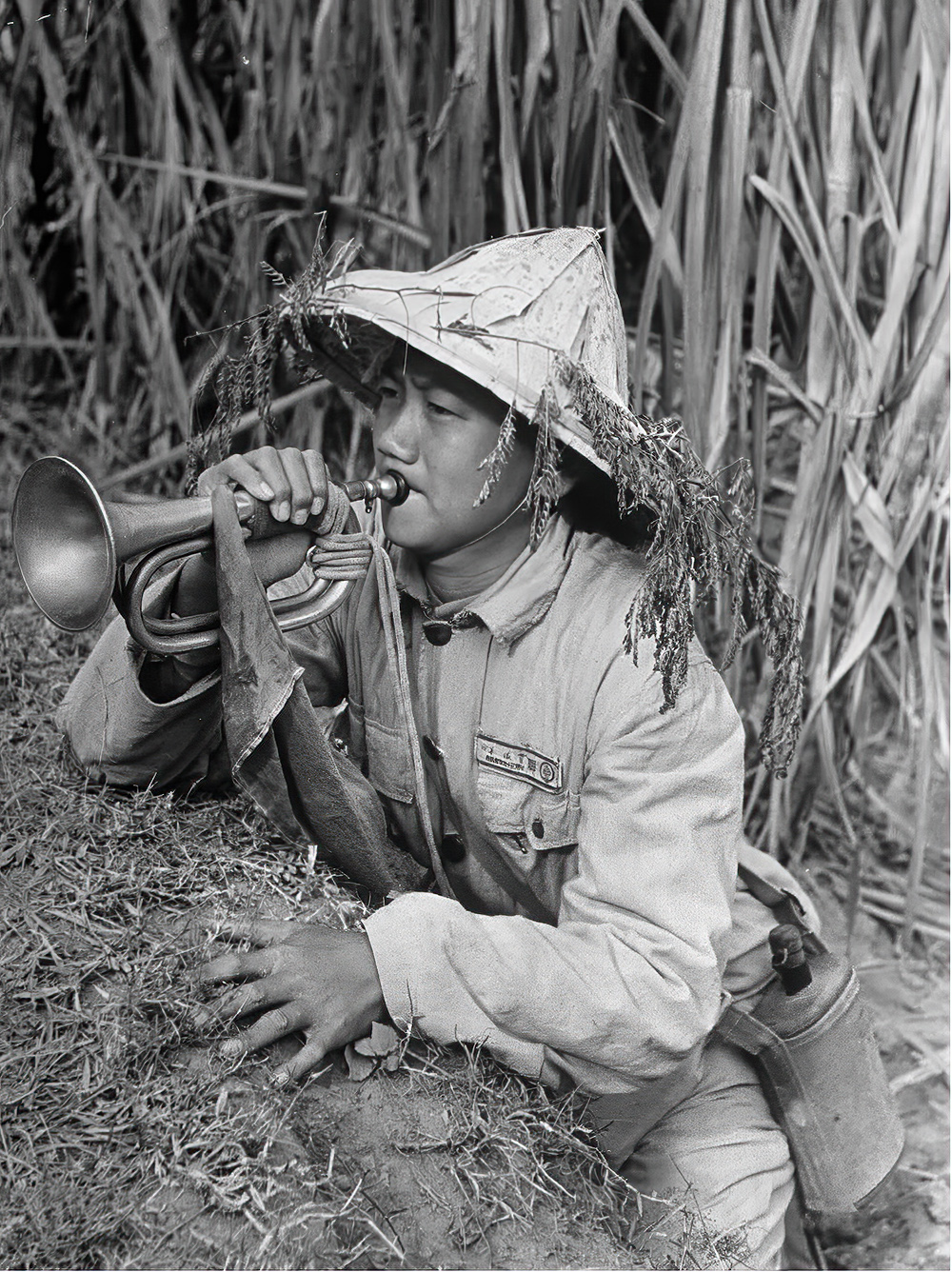 Chinese soldier blowing bugle, c. 1950. | LIFE Photo Collection
